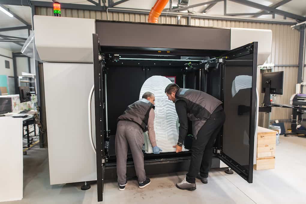 Technicians using warehouse technology to print 3d products